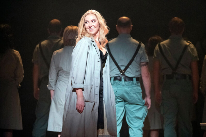Blond female singer playing Carmen at English National Opera